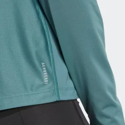 VESTE DEMI-ZIP OWN THE RUN FEMME